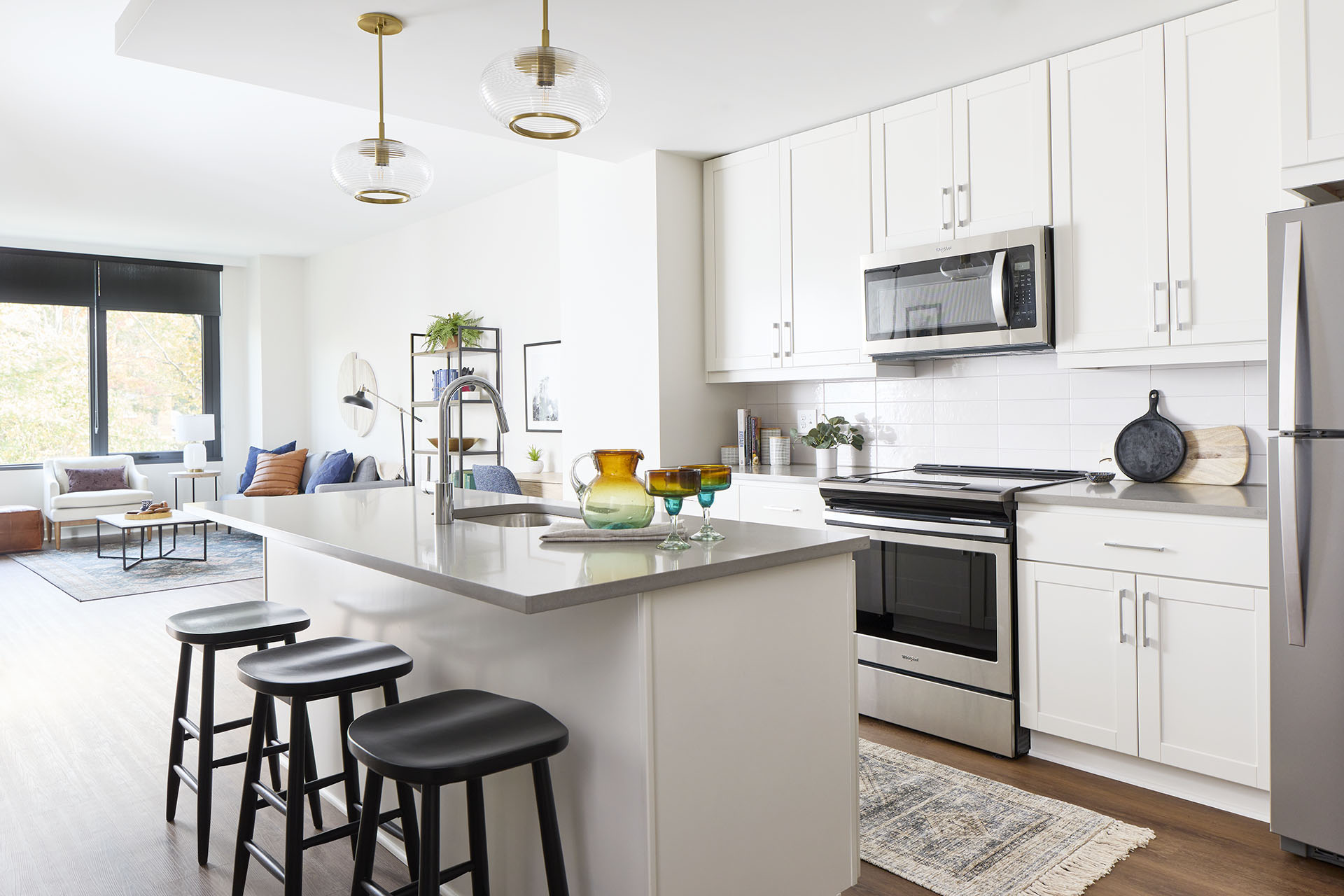 All white open concept kitchens with brass and chrome finishes