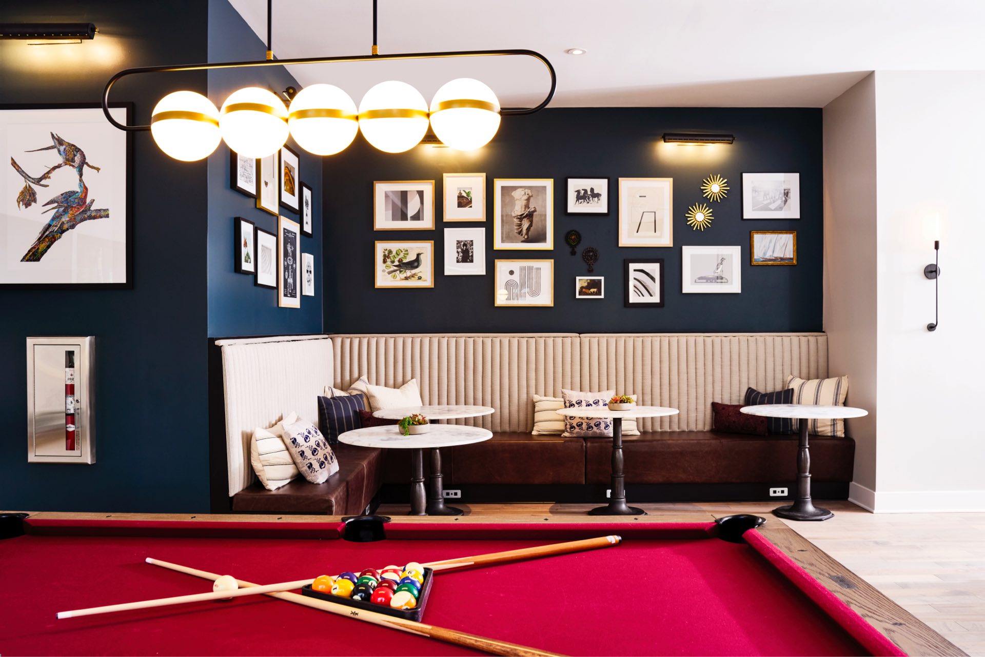 Comfy banquette seating and billiards table 